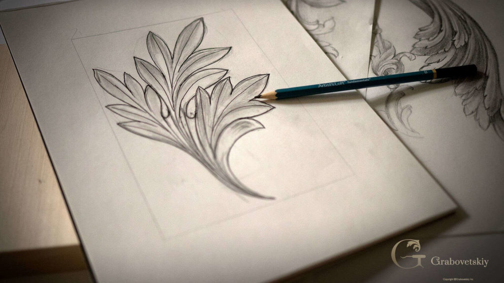 Sketch of a floral design for wood carving lessons. A pencil rests on the drawing, ready for the next step in the creative process. This image captures the beginning stages of wood carving classes, highlighting the artistic planning that goes into crafting beautiful wooden pieces.