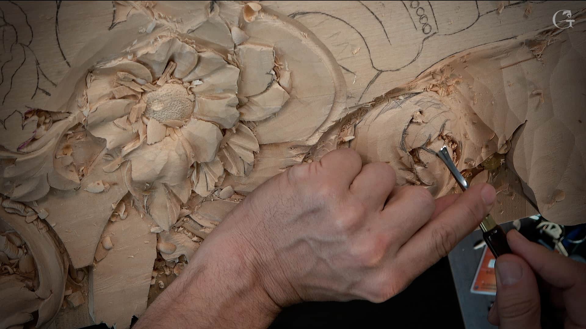 WOODCARVING LESSONS: A person carves detailed flower patterns into wood using a carving tool. The only person in the pictures is "Woodcarver Grabovetskiy". - Wood Carving tutorials