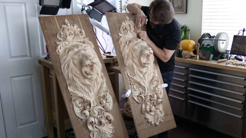 Alexander Grabovetskiy Making Money Carving wood. He Carves Lion Onlays for a High End client. Those Two lionhead onlays will be applied on doors. Is it possible to make money carving wood? Absolutely. Learn how to make money carving Lion head Onlays. Discover the secrets to creating beautiful, detailed, and professional-looking Lion head Onlays. Learn the skills and techniques required to create stunning wood carvings that will last a lifetime. Get tips on how to make the most of your business by creating custom wood carvings and selling them online. Wood Carving School offers lessons, courses, masterclasses, workshops, classes and videos to teach you how to make money carving lion head onlays. Learn the traditional art of wood carving and unlock the secrets of success in creating beautiful and unique wood decorations. Improve your carving skills, discover the best materials and tools to use and learn the techniques needed to create stunning carvings. Wood Carving School specializes in providing wood carving lessons, courses, masterclasses, workshops, classes and videos. Learn how to make money from carving Lion head Onlays with our top-notch woodcarving tutors and instructors. Improve your skills and become a master carver today!