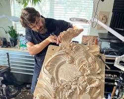 A skilled woodworker intensely focuses on intricate carving work at a well-equipped carving bench, demonstrating techniques learned in wood carving classes and lessons.