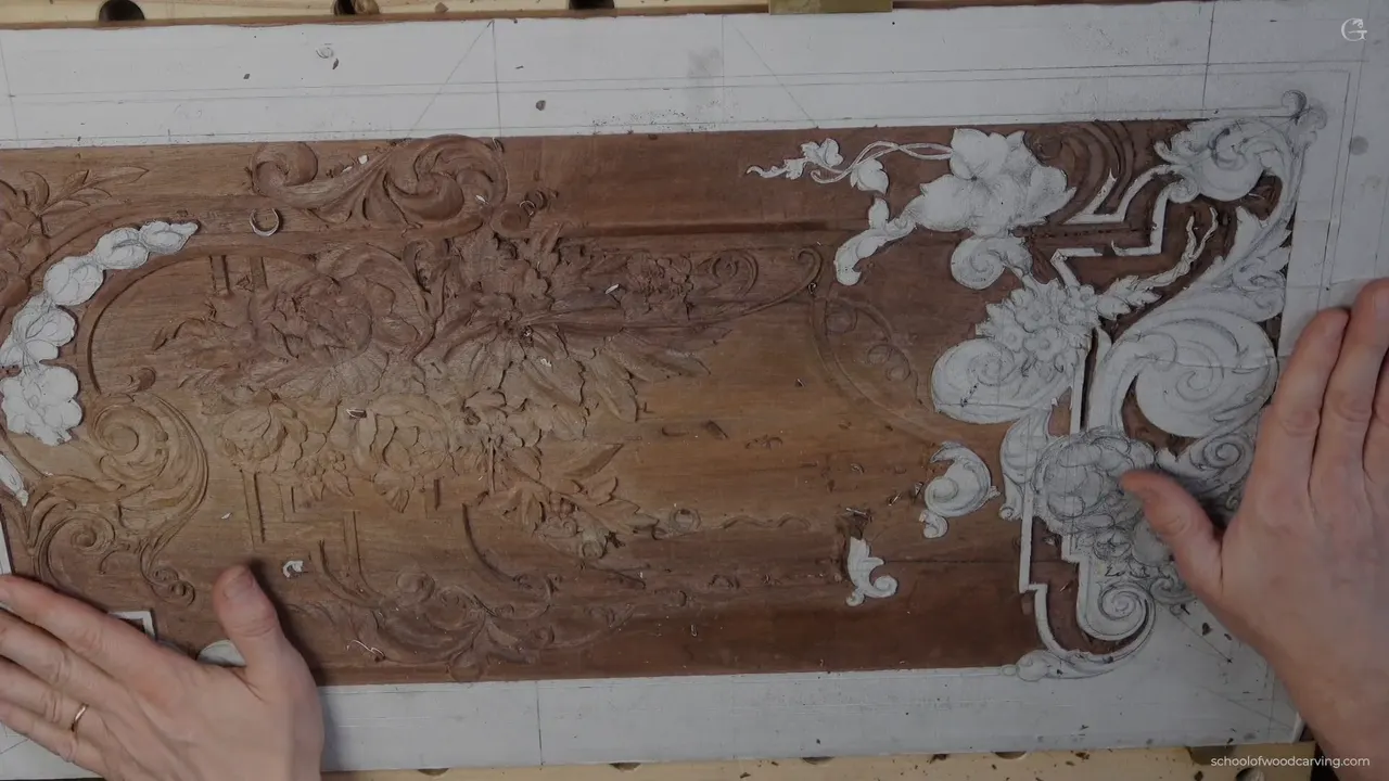 Carved furniture panel seen whole on the bench, flowers, leaves and moldings worked in relief.