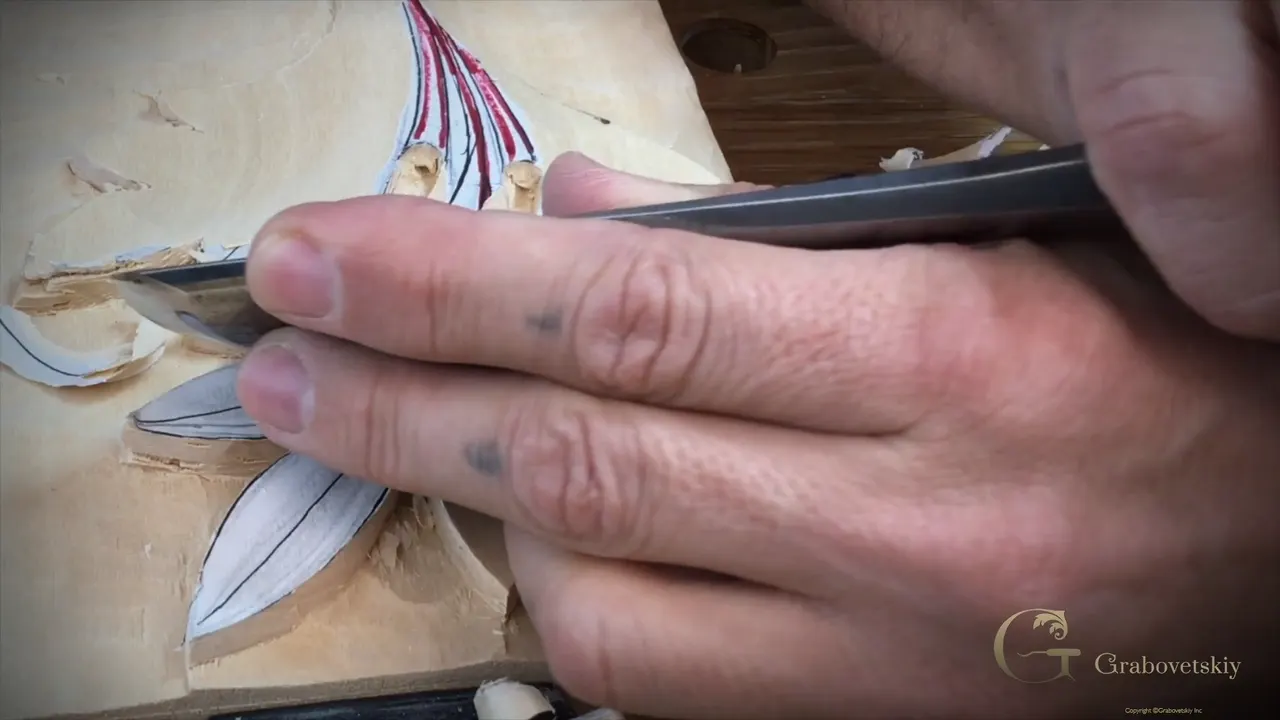 Only the corner of a wide blade touches wood, the hand braced beside it.