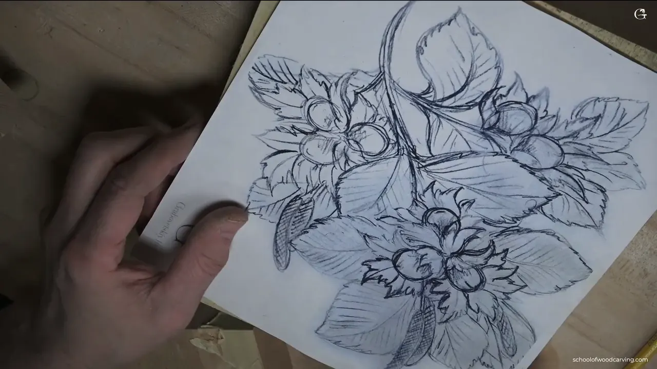 Alexander Grabovetskiy showing the solid basswood block the hazelnuts are carved from, not glued up from pieces