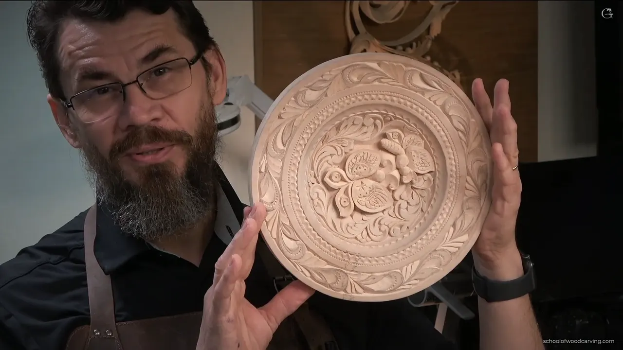 Holding the finished plate up to the camera at the end of the last lesson