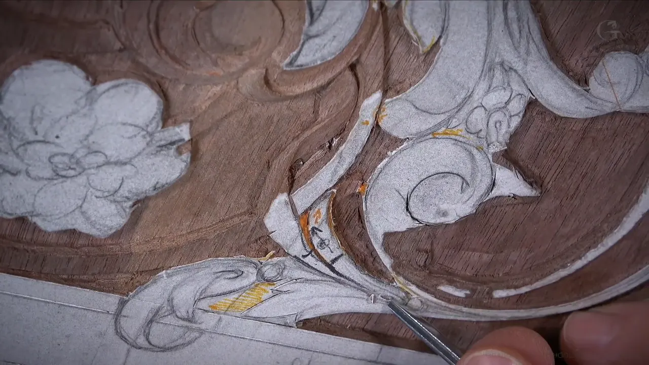 Fine point set at the centre of a leaf movement, orange marks drawn on the chalked paper around it