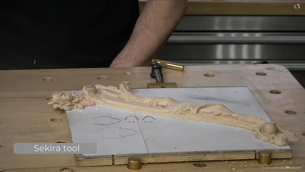 Whole panel from above with the acanthus running its length and the molding ground still rough.