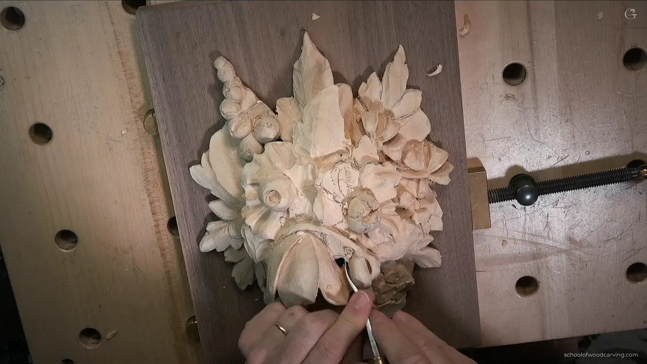 Back bent going into the tulip, the whole Grinling Gibbons style panel clamped down on its walnut ground