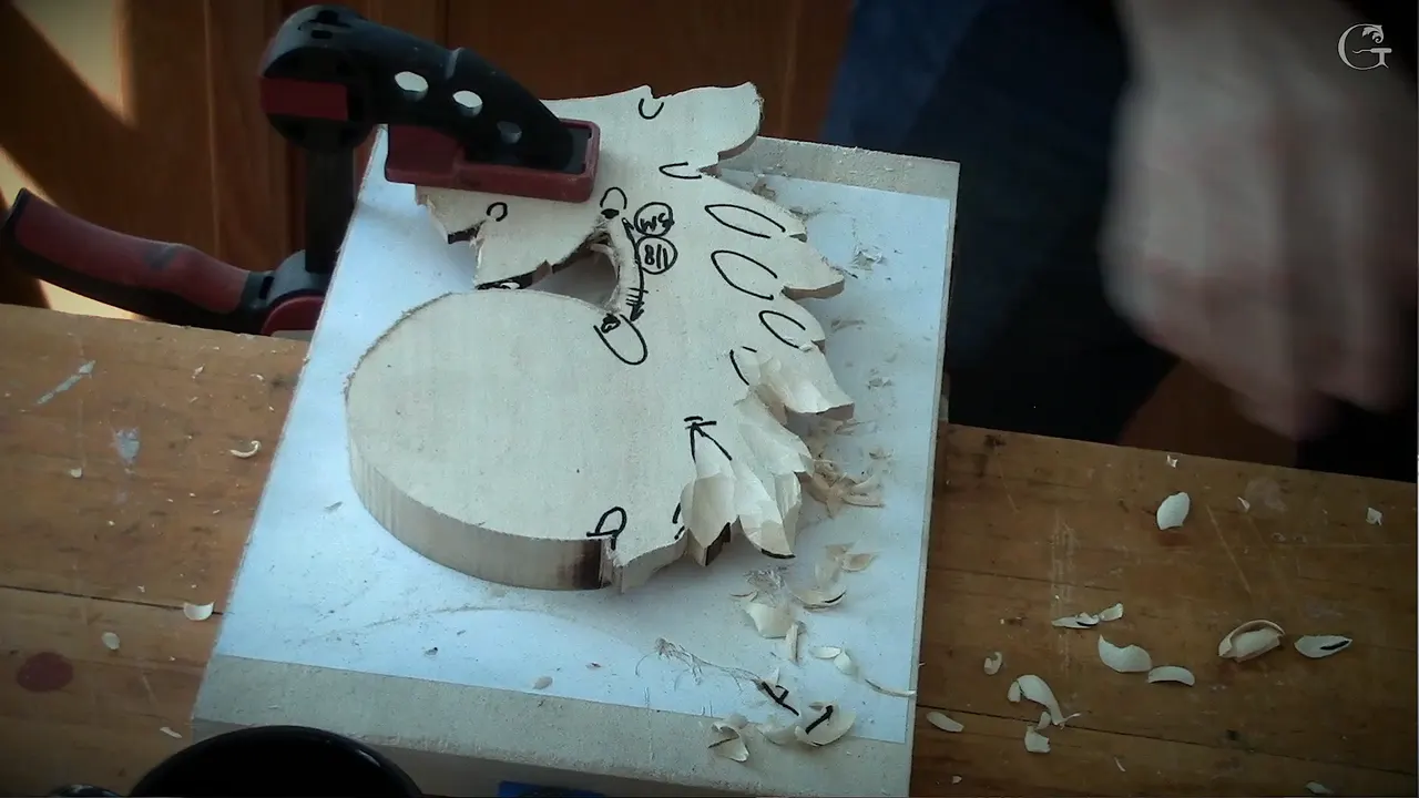Back of the piece clamped face down, marked in black, chips lying round it