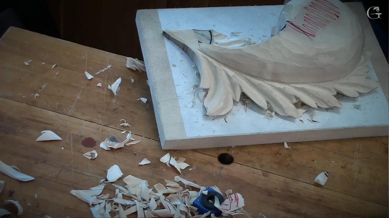 The rounded leaf on its board with no glue line anywhere in sight and shavings lying where they fell