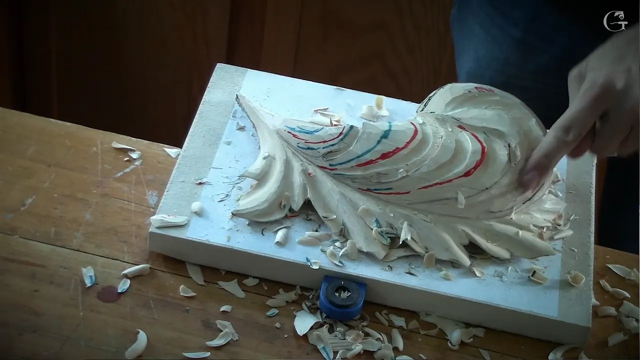 Carved pipes running down the leaf with the red and teal guide lines still showing between them
