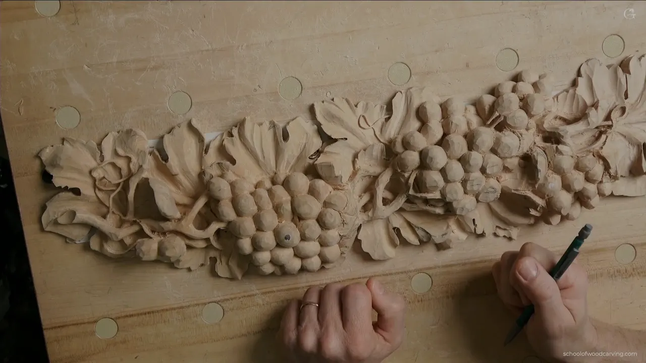 Whole panel from above with a pencil in hand, the vine running the length of the board