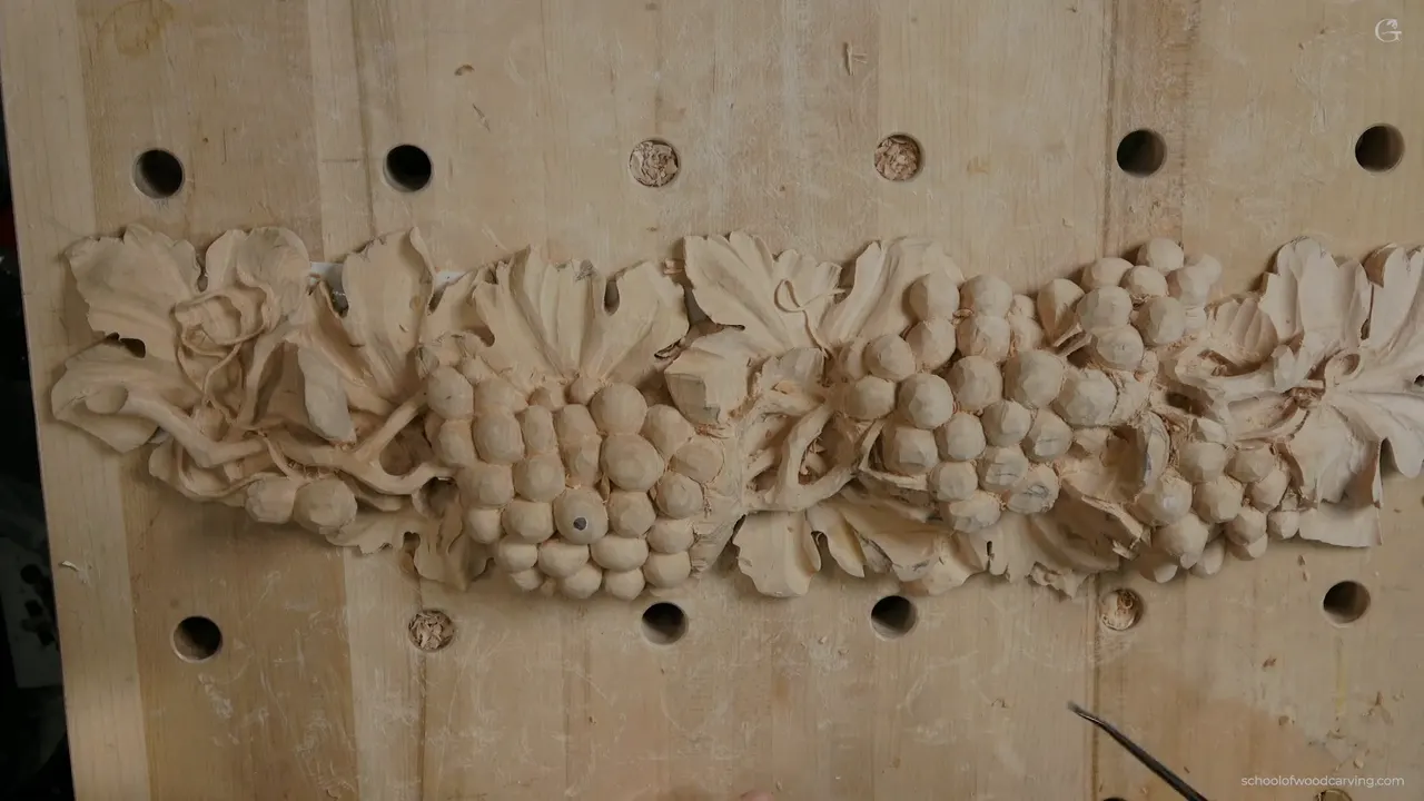 Whole grape panel from above, the vine running end to end across the board