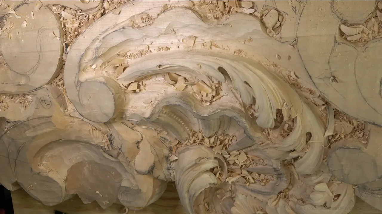 The whole acanthus head from above, curled leaves over hollows full of chips.