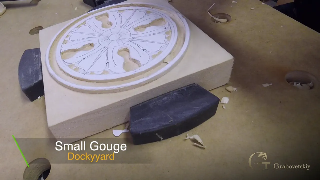 A dockyard gouge held to the eye of a rosette leaf, named in a caption on screen