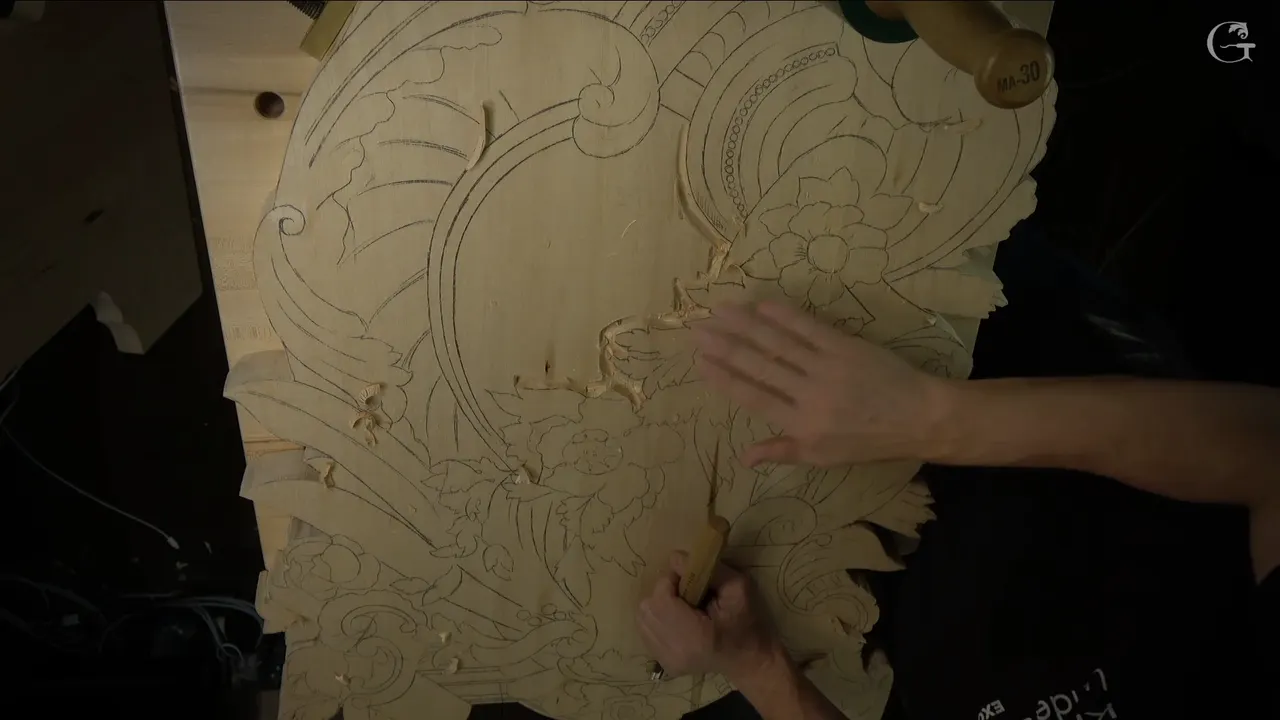 Hands on the board after the first outline, grooves around the middle