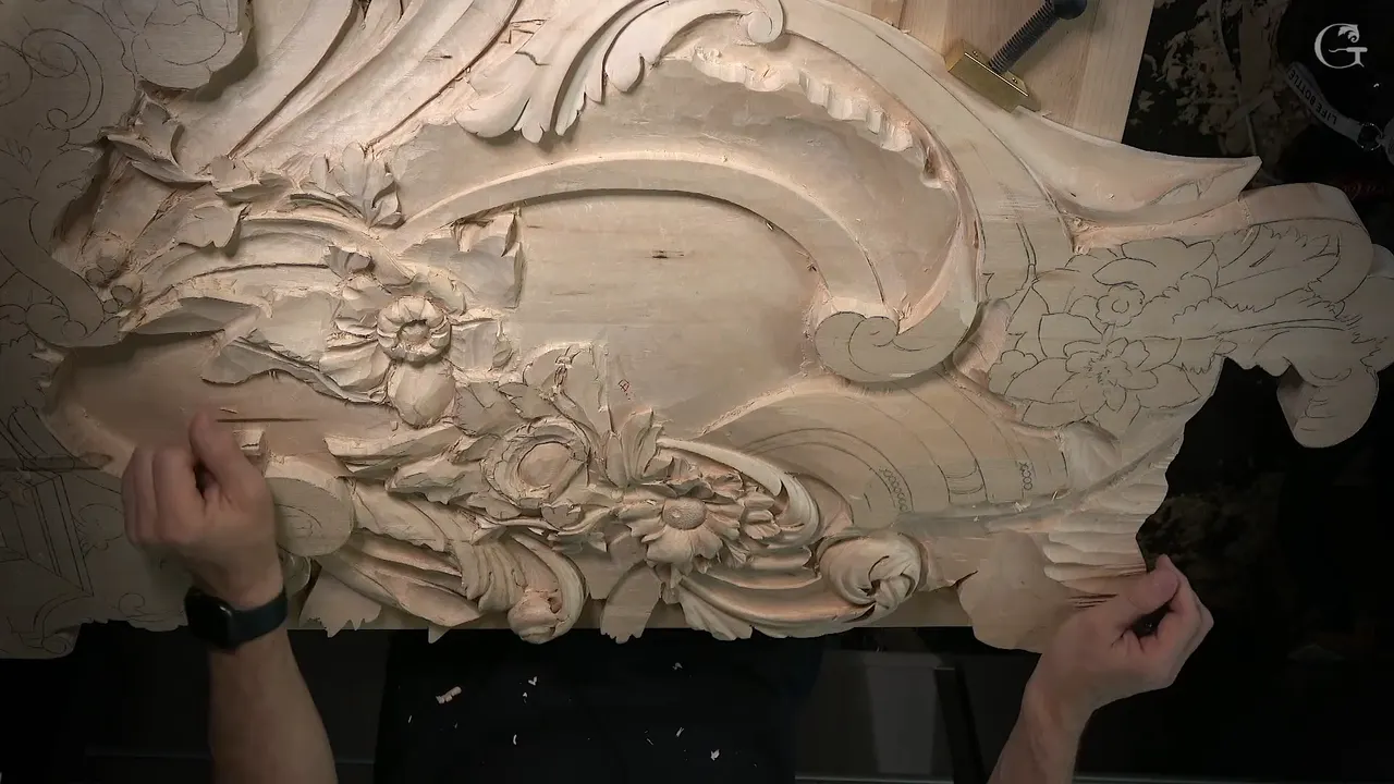 Both hands steady the finished half of the Venice Room panel while the right half is still only pencil