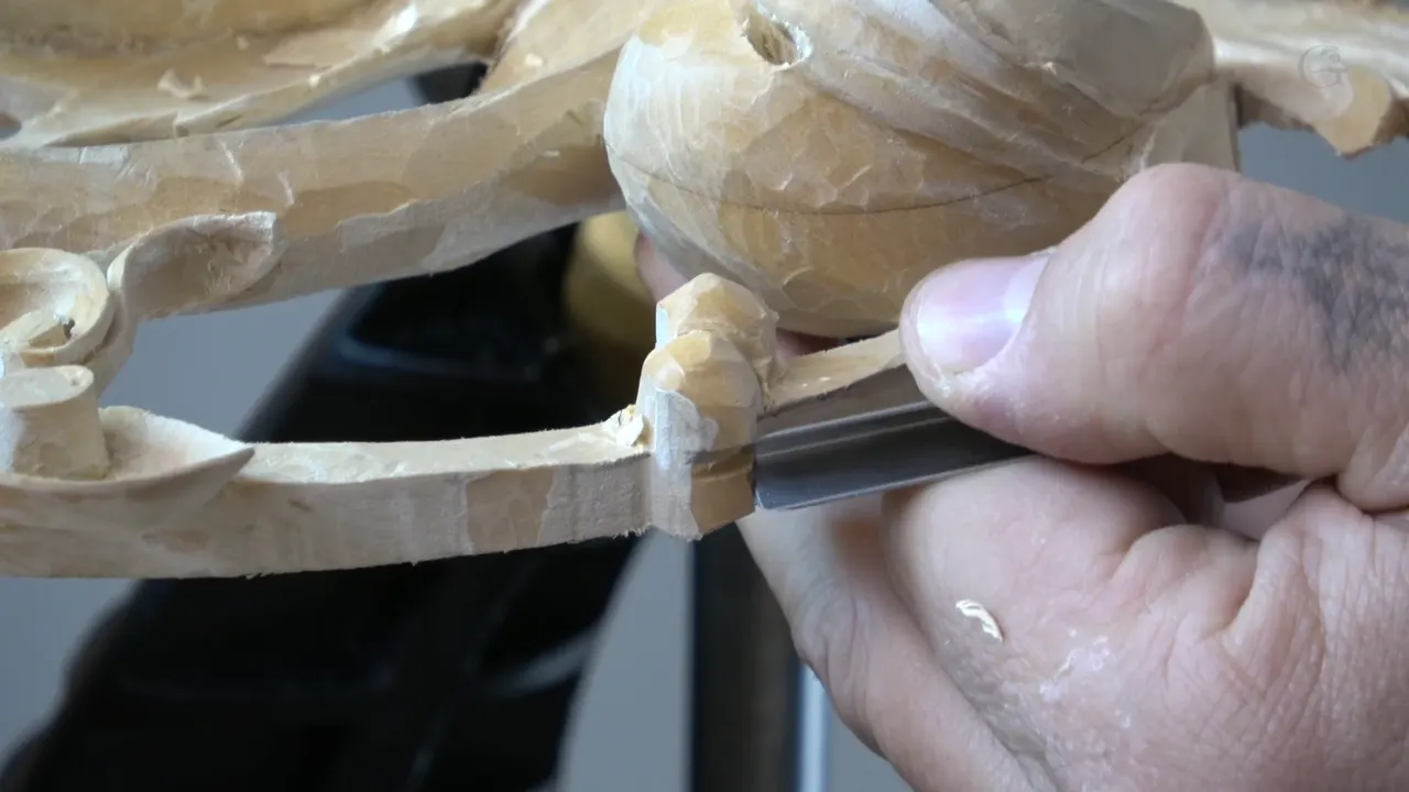 My holding hand directly beneath the blade, the arrangement every book warns against and this work requires.
