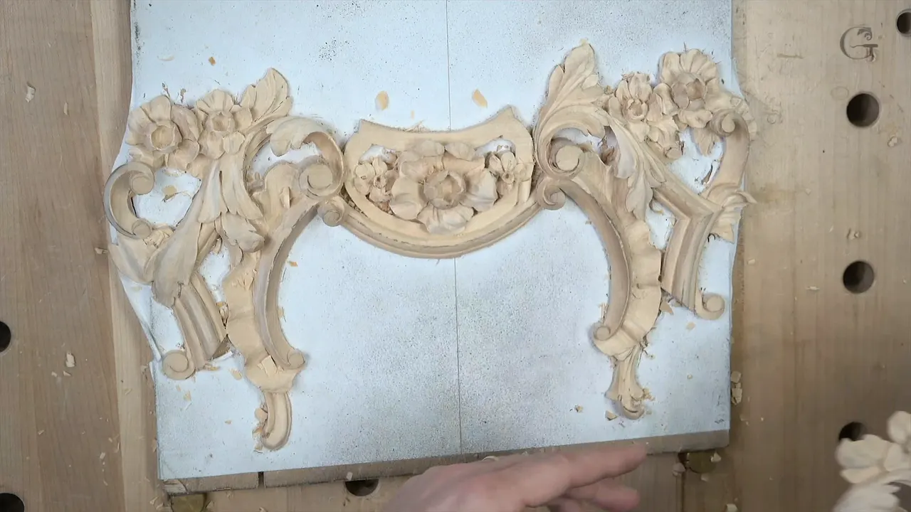 Panel on its board with a hand steadying the lower edge