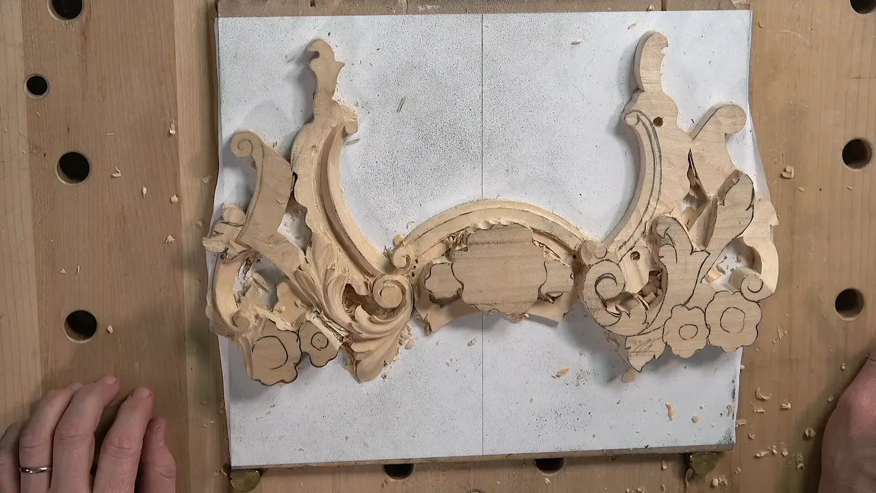 Acanthus leaf shaped and blended, concave down each side and a convex ridge running through the middle