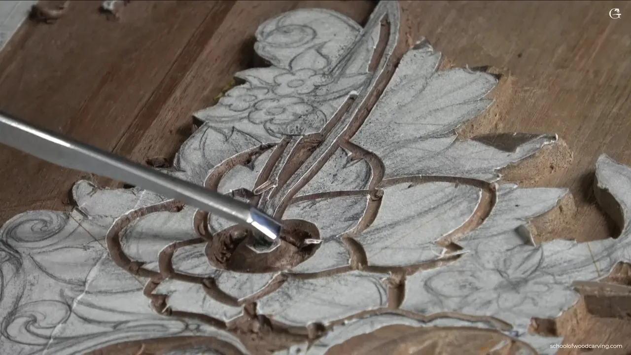 Blade tip inside the rounded center, the hollow beside it holding shadow.
