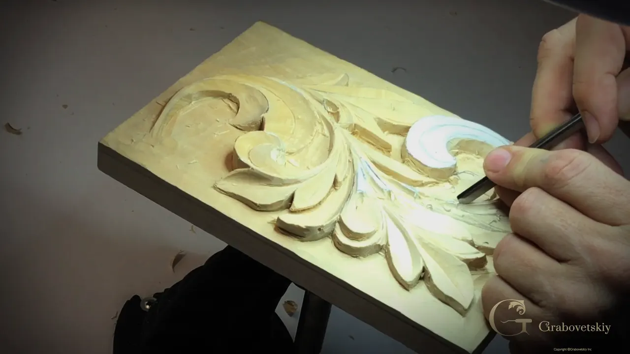 Bright light washing across the panel while a V tool works one lobe