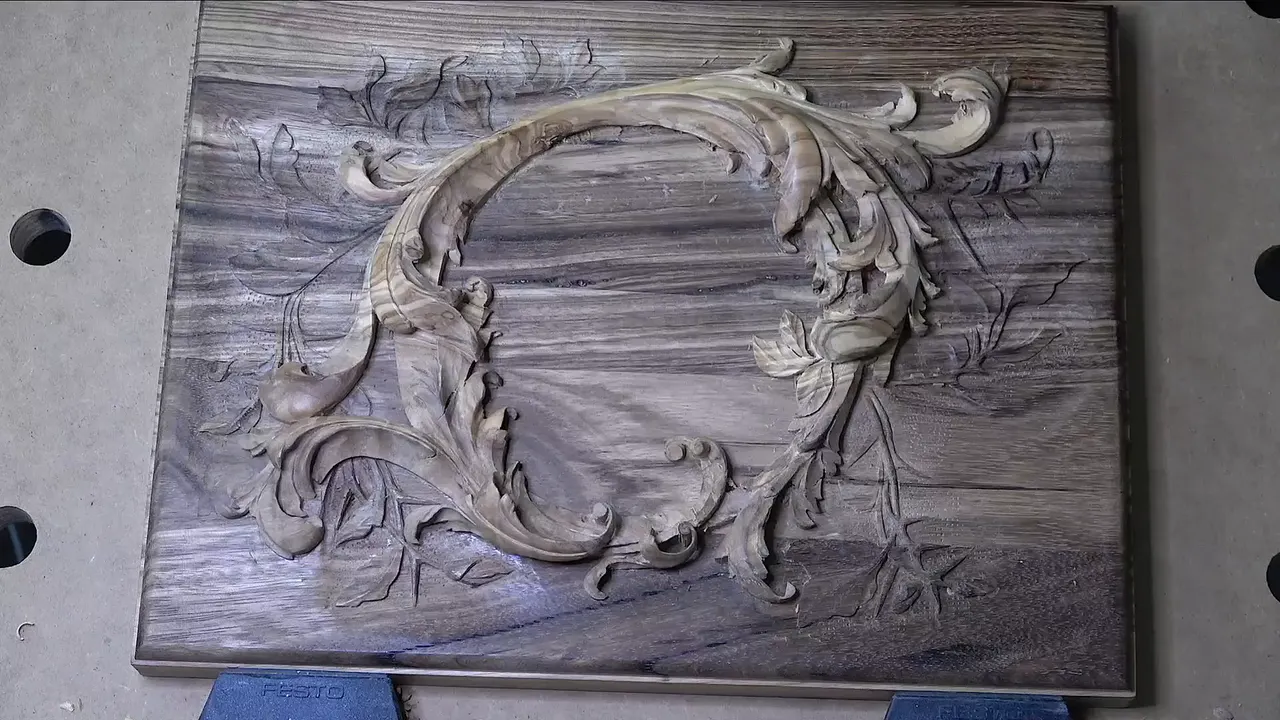 Second layer of the lily box lid finished, olive wood scrolls and leaves on dark acacia, seen from above
