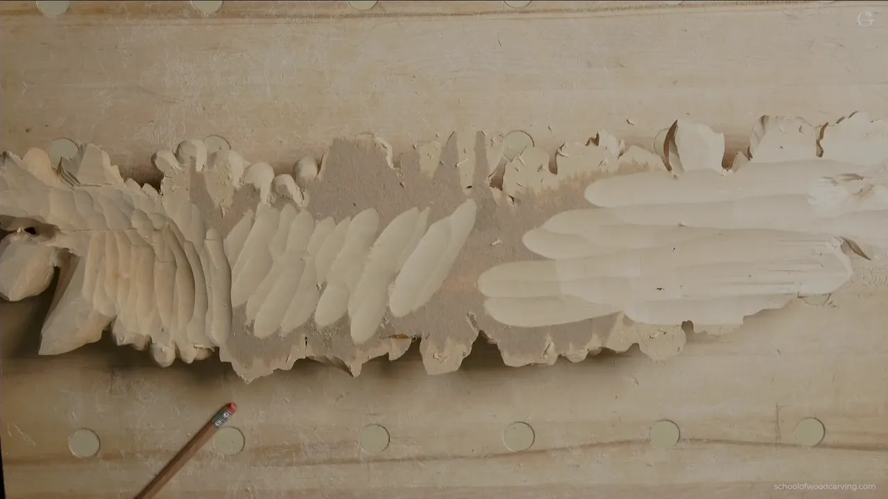 The back of the panel after hollowing, a run of leaf shaped craters