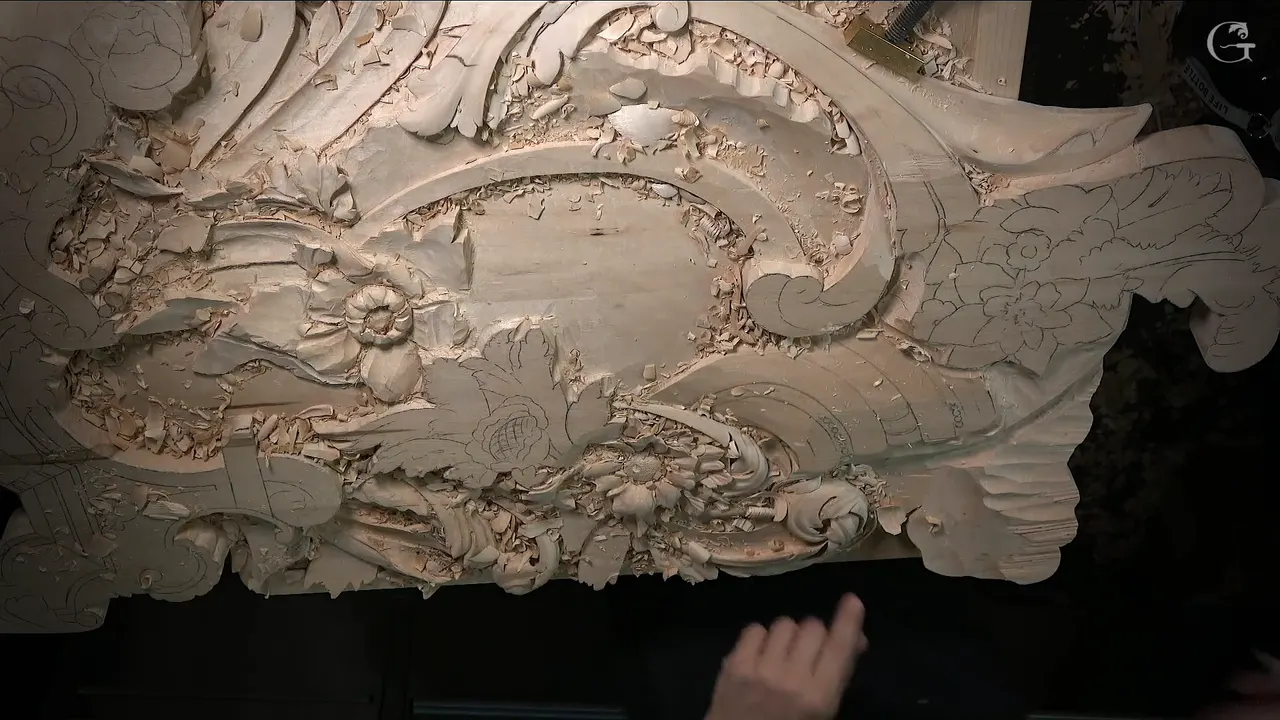The whole panel seen from above, with a pencil flower beside the first carved one