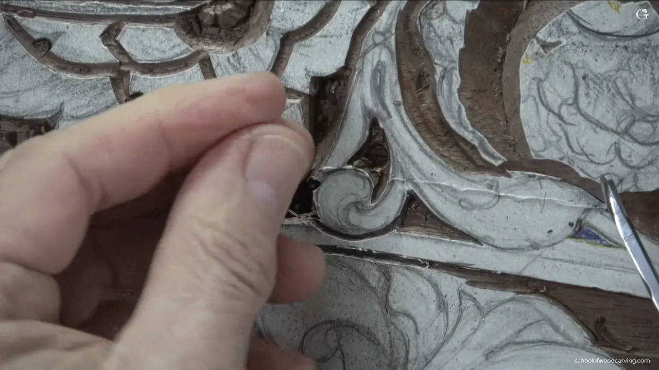 Fingertips pinch the loose plug above the surface it came out of.