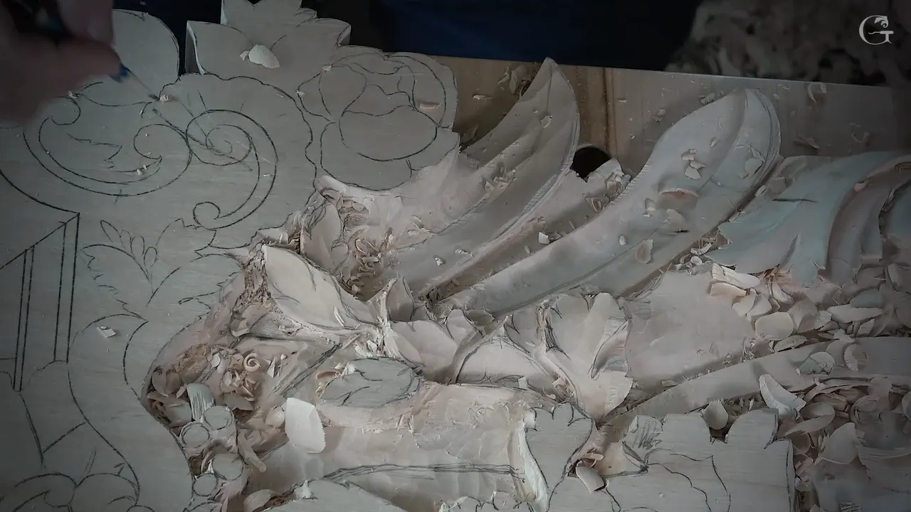 Small carved leaves with fresh pencil lines drawn back over them, chips lying between