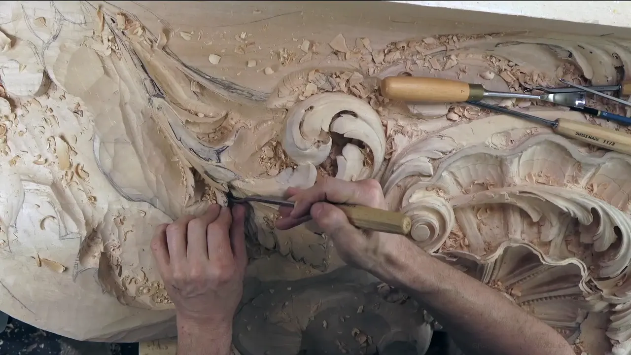 Working under the lobes with a slim gouge, the ribbed shell to the right.