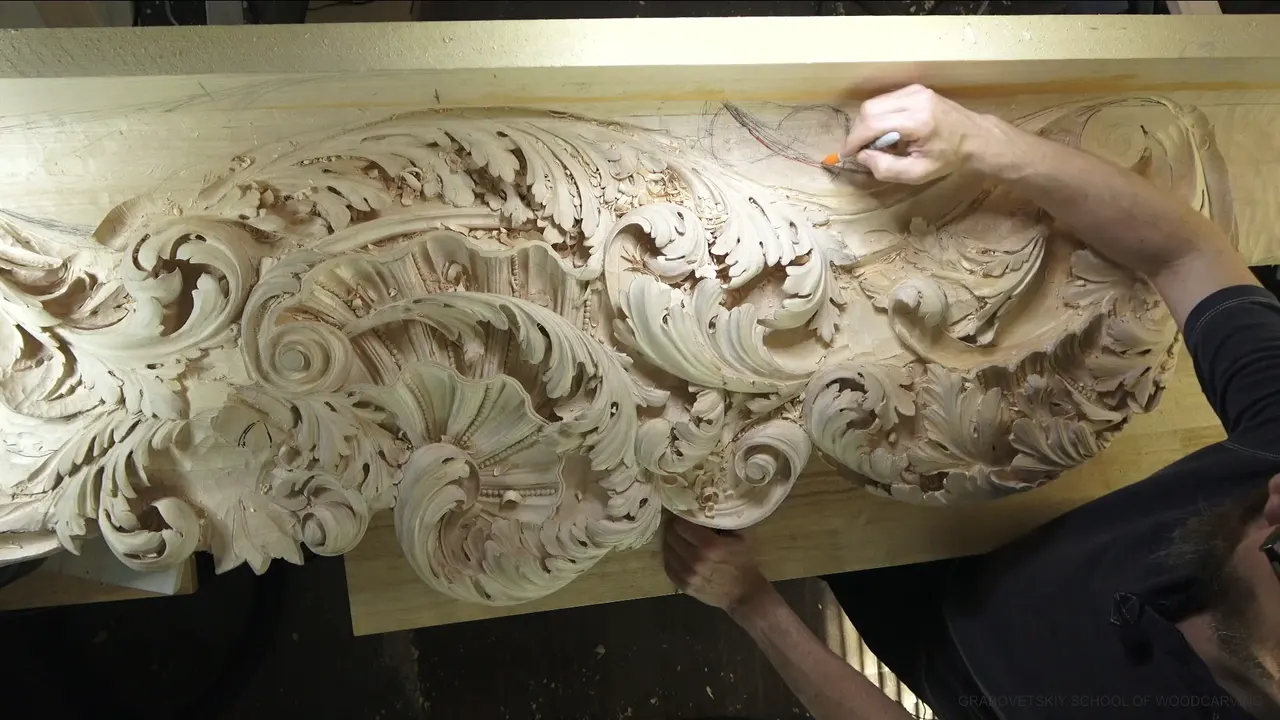 From above, the long carved panel with its shell and acanthus, and a hand drawing at the upper right.