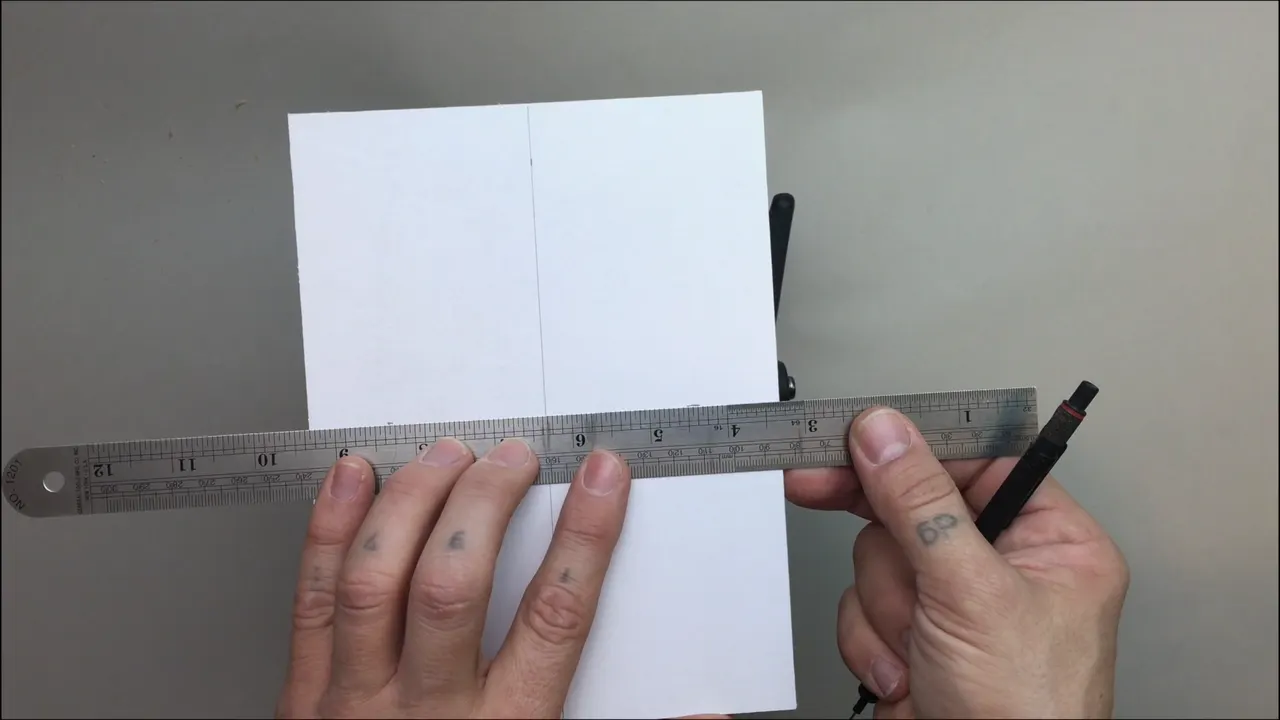 Ten by ten grid ruled on paper before a single curve of the acanthus goes down