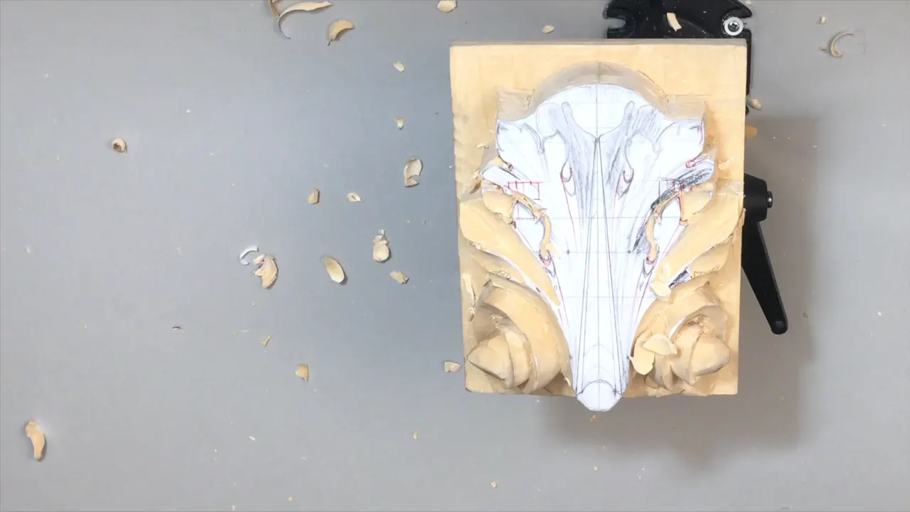 Panel alone on the vise with chips all round it and the drawing half gone