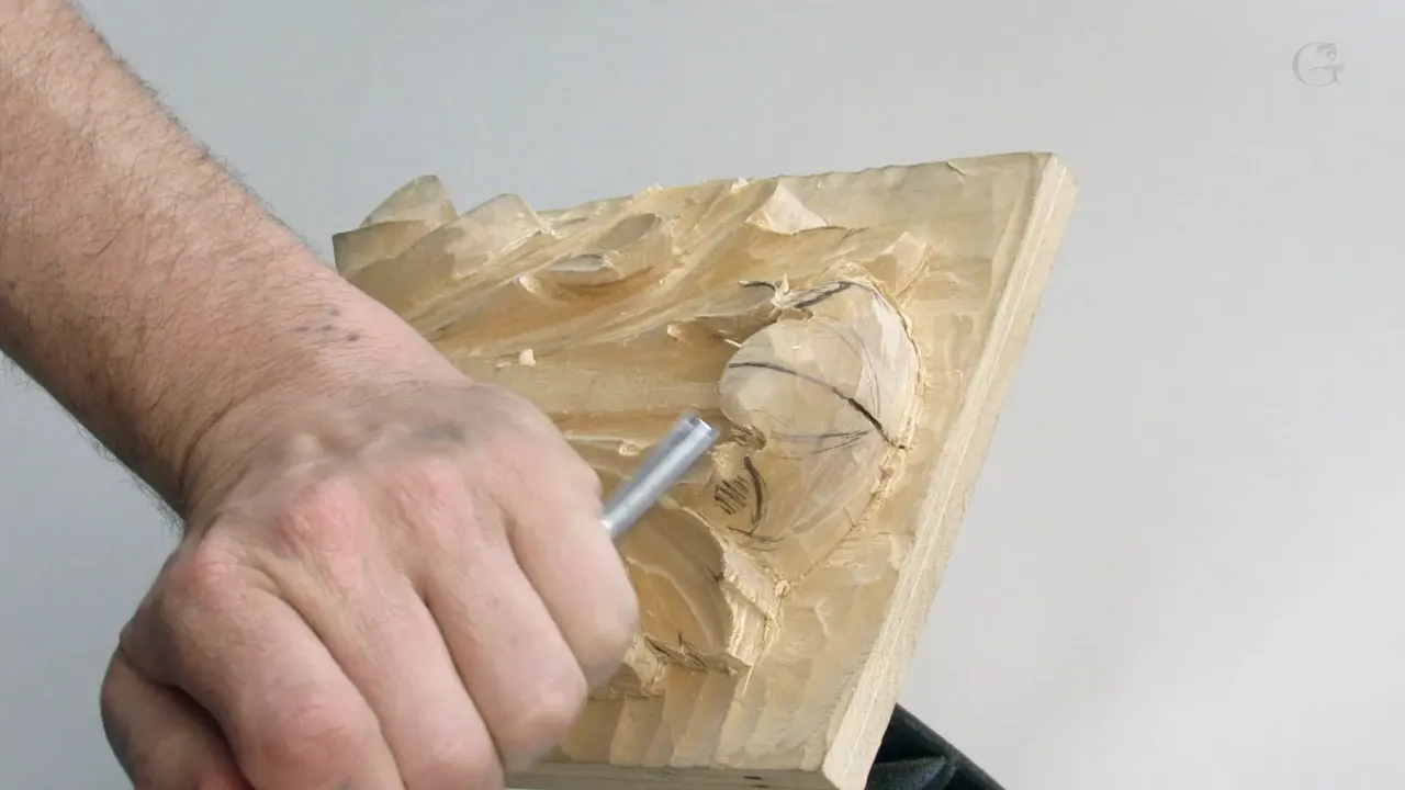 Fist closed round a short handle, the blade barely fitting the gap it is asked to enter