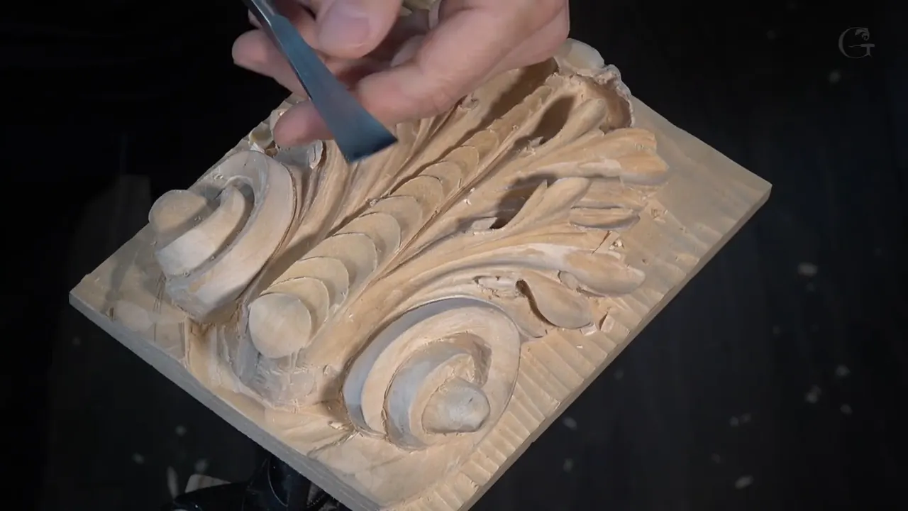 Chisel lying across the finished Roman acanthus leaf, sixteen workshops done