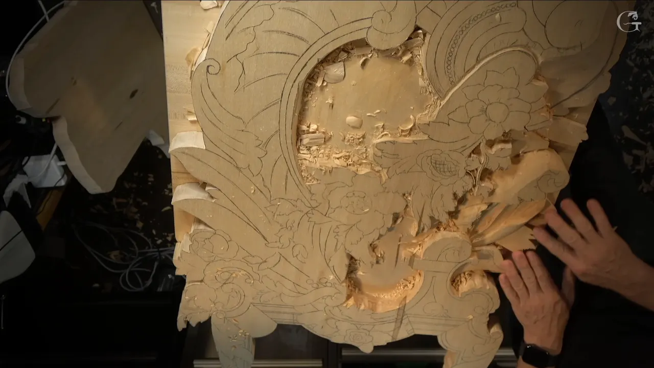 Whole panel from straight above, pencil scrolls drawn around a deep excavated hollow and the carved leaves