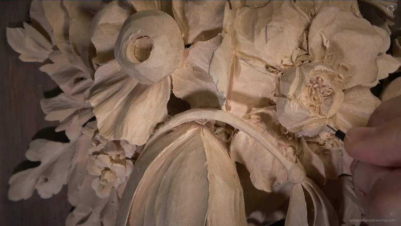Two flowers side by side, the left one with a plain round hollow, the right one full of swirling inner petals