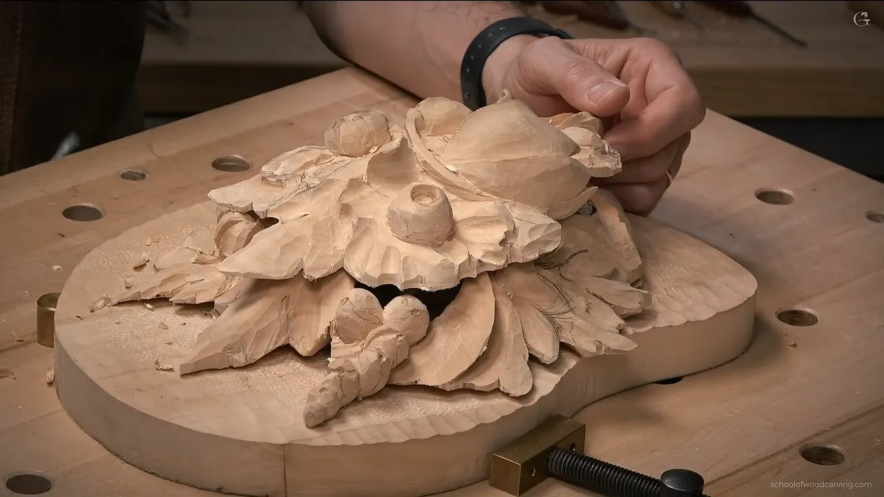 The carving lifted off the bench at a low angle, where it plainly reads as one slab sitting on another