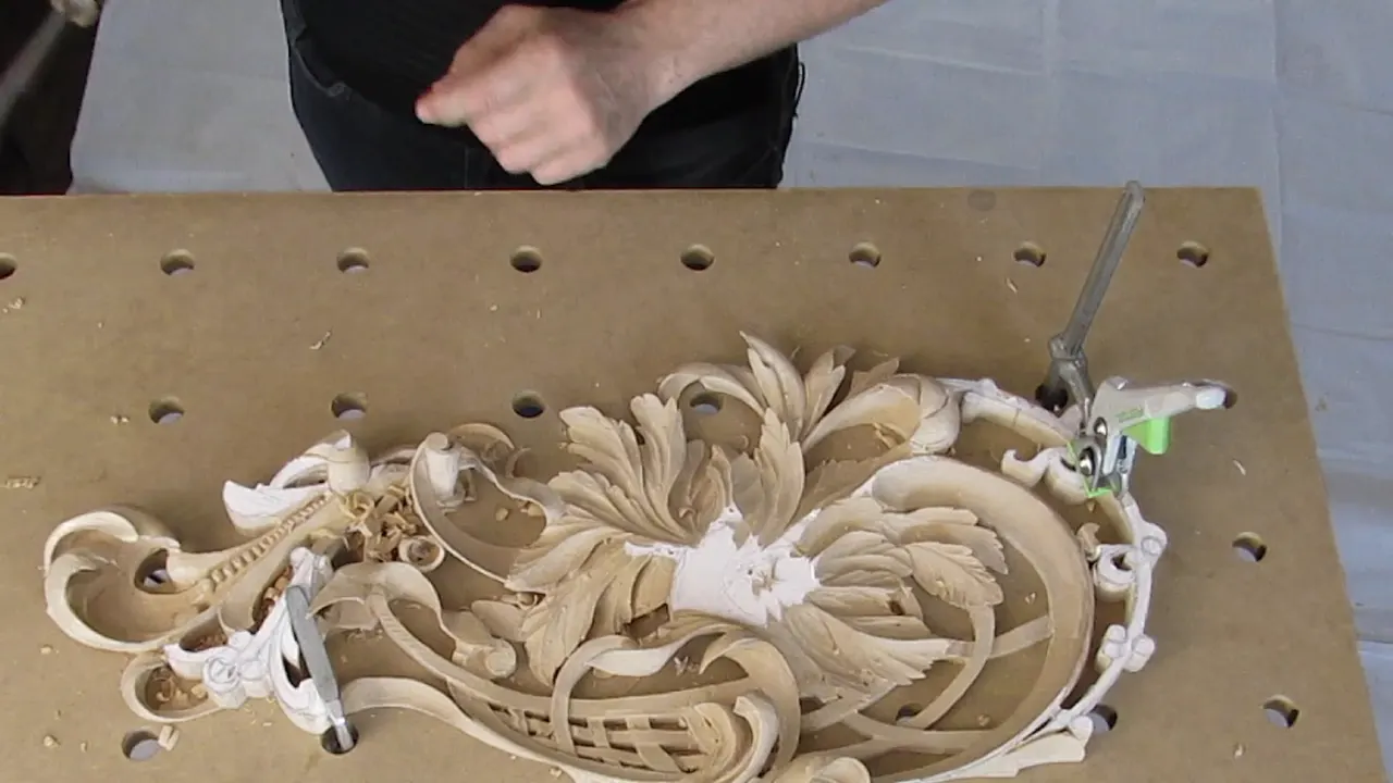 The whole panel clamped to its drilled board, which is what makes any of the fast cuts possible at all.