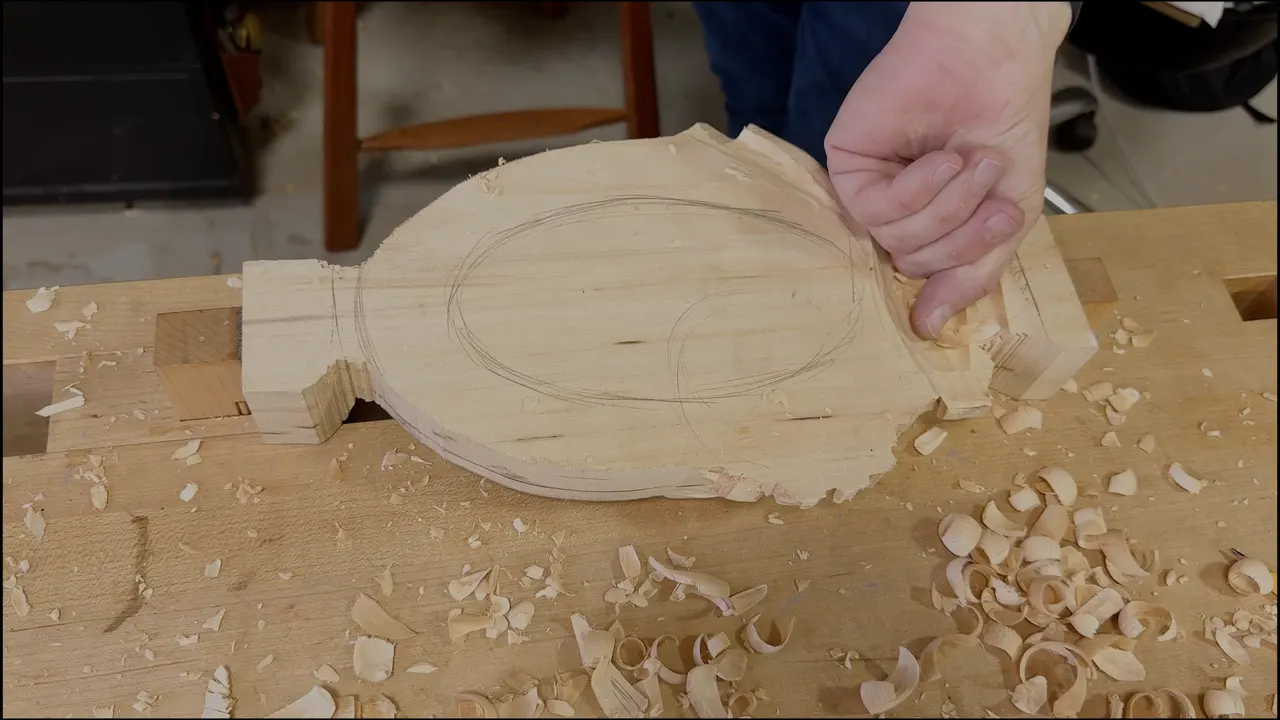 Fingertips pinching the thin end of the upturned tray
