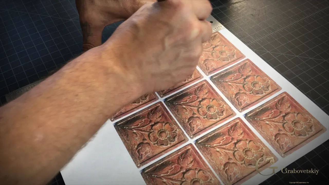Knife and ruler trimming a printed sheet of nine rosettes