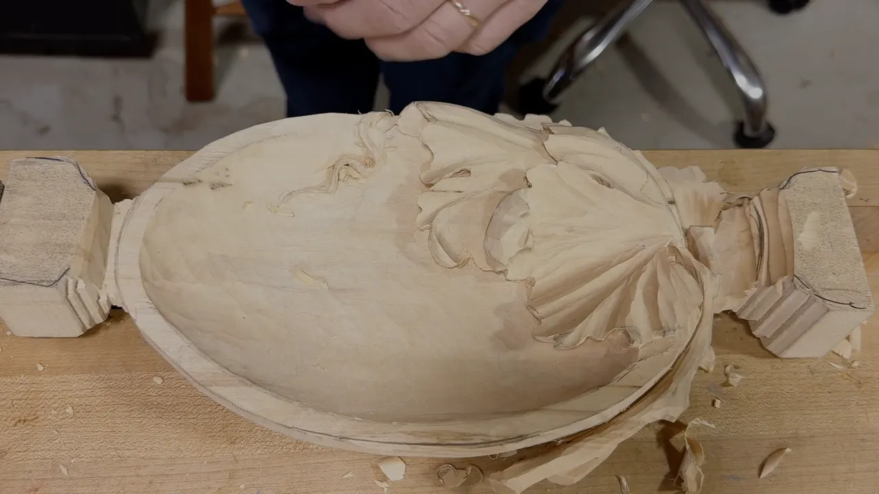 Grape leaf carved over one end of an oval bowl, both legs still on