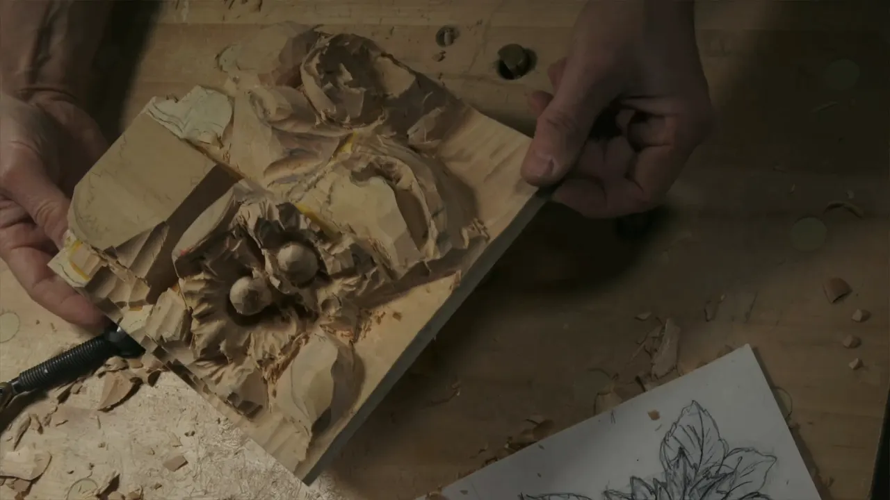 Panel tipped toward the camera, two rounded nuts sitting in a rough husk near its middle