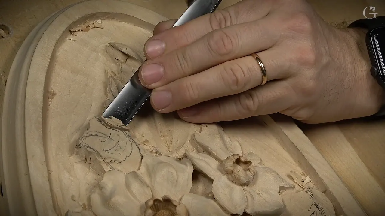 Wide gouge set against a bud drawn in pencil, a curl sketched across its face, flowers below